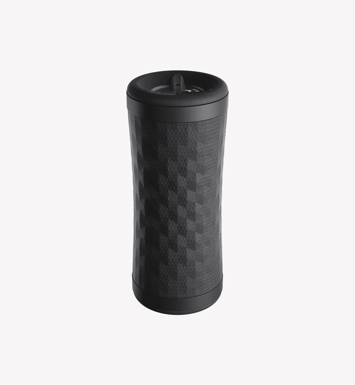 Black contoured vibration roller standing upright with a textured diamond grip surface