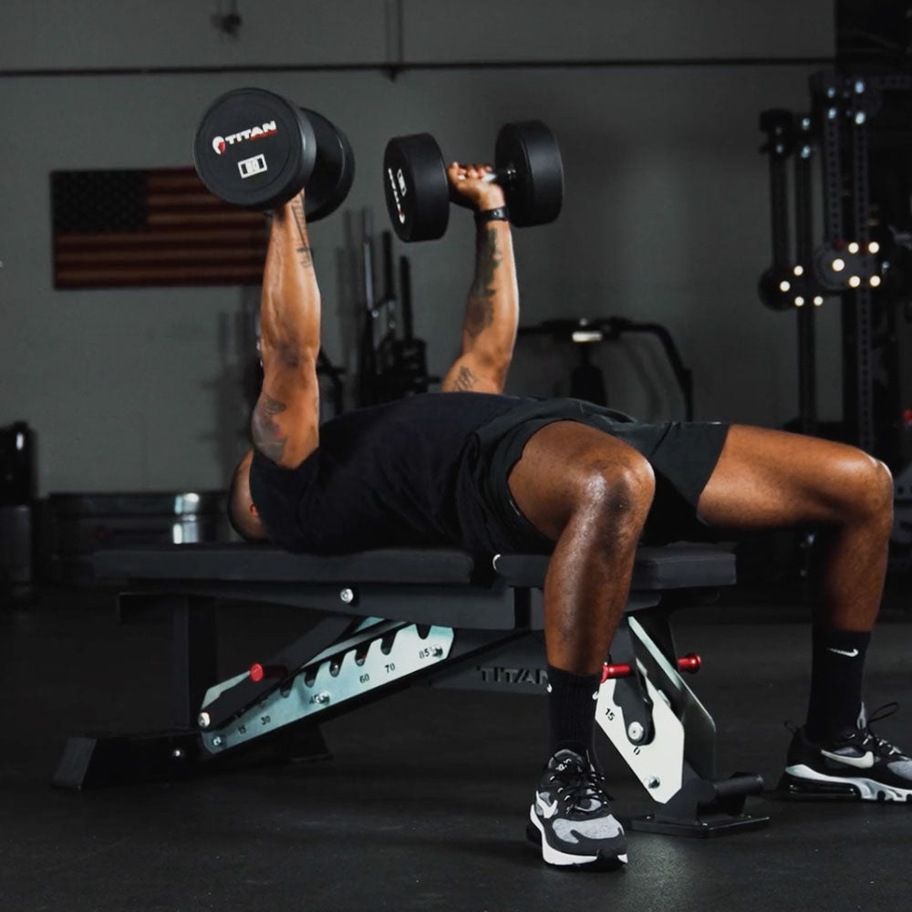 Dynamic Titan Stand Up Bench in use with dumbbells