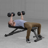 Body-Solid GFID225B bench in use for dumbbell press