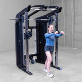 Body-Solid GSFR100 with woman performing cable fly