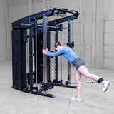 Body-Solid GSFR100 with woman performing leg kickback