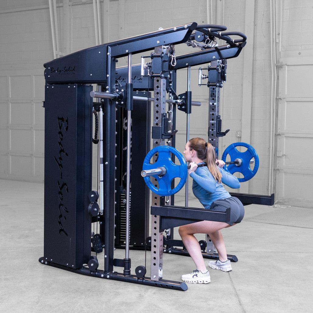 Body-Solid GSFR100 with woman performing barbell squat side view