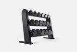 Three-tier black-stained wood rack holding nine pairs of nickel-plated dumbbells with dark end caps