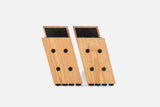 Pair of oak HiRise Kit legs with black steel tops, front view