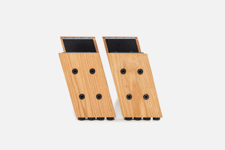Pair of oak HiRise Kit legs with black steel tops, front view